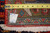 10x13 Persian Sarouk rug back showing knot density, cotton foundation, tape measure and fringe