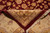 Folded corner revealing tight hand-knotted back, cotton fringe and even knotting of organic wool pile