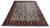10x14 Persian Tabriz rug photographed at an angle showing ivory field and crimson red border