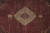 Close-up of central medallion surrounded by dense Herati fish lattice in red and ivory