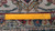 Back of the 8x11 Persian rug with ruler showing knot density and cotton foundation