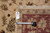 Back tag and tape measure confirming size on genuine hand woven Oriental rug number 10199
