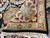 Folded corner reveals tight knot structure, cotton fringe and plush lustrous wool pile underside