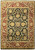 Full overhead view of black and burgundy hand-knotted wool rug with all-over floral field