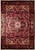 8x12 Persian Heriz rug shown flat, deep red field, ivory spandrels, graphite black floral border