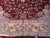 Border close up with gold main band, guard stripes and dense burgundy floral field