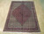6'6" x 8'8" Persian Bijar rug displayed flat on light wood floor with ivory fringe