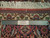 Ruler and Authentic Handmade label on cream floral border with white cotton fringe ends