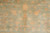 Pomegranate, vase and blossom motifs drawn in soft coral and apricot on green
