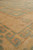 Greek key fretwork border in sage and camel gold seen from low corner angle