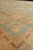 9' x 12'2" Chobi rug viewed low across the field toward the wide gold border