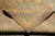 9 x 12 Chobi rug folded back showing tight hand-knotted weave and cotton foundation