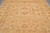 8 x 10 neutral Chobi rug close-up showing rosettes, leafy vines and muted terracotta highlights