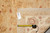 Back of rug with tag 11574 and tape measure confirming 8 x 10 hand-knotted weave