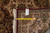 Back of rug with inventory tag and tape measure confirming the 8'1 by 9'8 size
