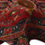 Folded pile revealing thick wool nap, navy guard stripes and angular serrated leaf motifs