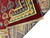 Folded edge showing dense wool pile, banana yellow guard stripes and hand-knotted 12x18 Kazak construction