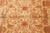Field close-up of paired palmettes, curling serrated leaves and fine red outlines on beige ground