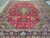 Full length view of semi-antique Persian Tabriz rug showing balanced medallion, spandrels and wide navy border