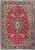 Red field 9'7" x 12'10" Persian Tabriz rug with navy medallion and olive green spandrels