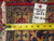 Back of the rug showing tight hand-knotted wool weave, dealer tag 6033 and measuring tape