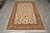 5'8" x 8'9" Sino Tabriz rug photographed lengthwise on grey tile with fringe forward