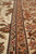 Guard stripes and salmon border detail with ivory flowers showing fine hand knotting