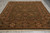 Hand-knotted Indian area rug displayed flat, showing symmetrical floral field and wide olive main border