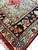 Border close-up with ivory floral vine, navy field flowers and bright turquoise inner stripe