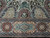 Burgundy and navy cartouche border below paisley boteh panels in fine hand-knotted wool
