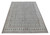 Angled floor view of ivory and gray paisley Persian rug showing repeating boteh rows lengthwise