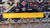 Back of the rug with ruler showing hand-knotted wool weave density and cotton foundation