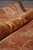 Rolled edge of the 8'8" x 11'4" Heriz rug showing wool pile depth and selvage