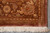 Corner detail with rosette filled brown border, mauve outer band and thick ivory cotton fringe