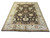 9'3" x 12'2" hand-knotted Indian Oushak rug angled on white studio floor showing full design