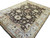 Perspective view of the 9x12 Oushak style rug highlighting cream guard borders and rust floral accents