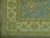 Corner detail of ivory border, twin guard stripes and pale blue selvage with clean fringe