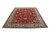 9'10" x 12'10" Persian Tabriz rug shown at an angle with ivory border and red field
