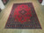 Large 10x11 near square Persian rug photographed full length showing balanced medallion and corner design