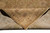 Folded corner revealing the tight hand-knotted back, cotton foundation and matching front colors of the design