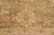 Large ivory palmette blooming against the olive brown field with slate blue leaf accents