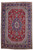 Overhead view of red Persian Tabriz rug with navy medallion, ivory lattice ground and floral border