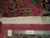 Back of this 10' x 12'10" hand-knotted Mashad rug with ruler showing knot density
