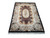 6'4" x 8'2" Chinese Aubusson rug angled view showing black border and silvery ivory scrollwork field