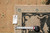 Back tag and tape measure confirming the 8'8" x 11'8" size of this hand-woven Oriental rug