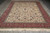 9' x 12'7" hand-knotted wool rug photographed flat showing all-over vine and palmette field