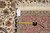 Reverse side with original hand woven Oriental rug tag F-3175 and tape measure across knots