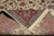 Folded corner revealing back of rug, showing even knotting and cotton foundation weave