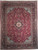 Berry red Persian Tabriz rug with ivory medallion, navy floral border and soft blue spandrels