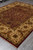 Traditional 8x9 area rug displayed at an angle on grey floor for room scale